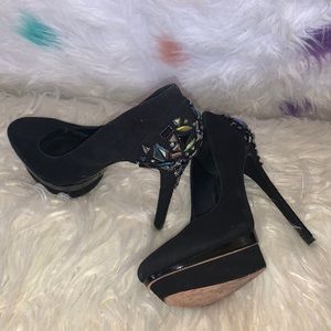 Tall black Brian Atwood pumps with rhinestones on the back